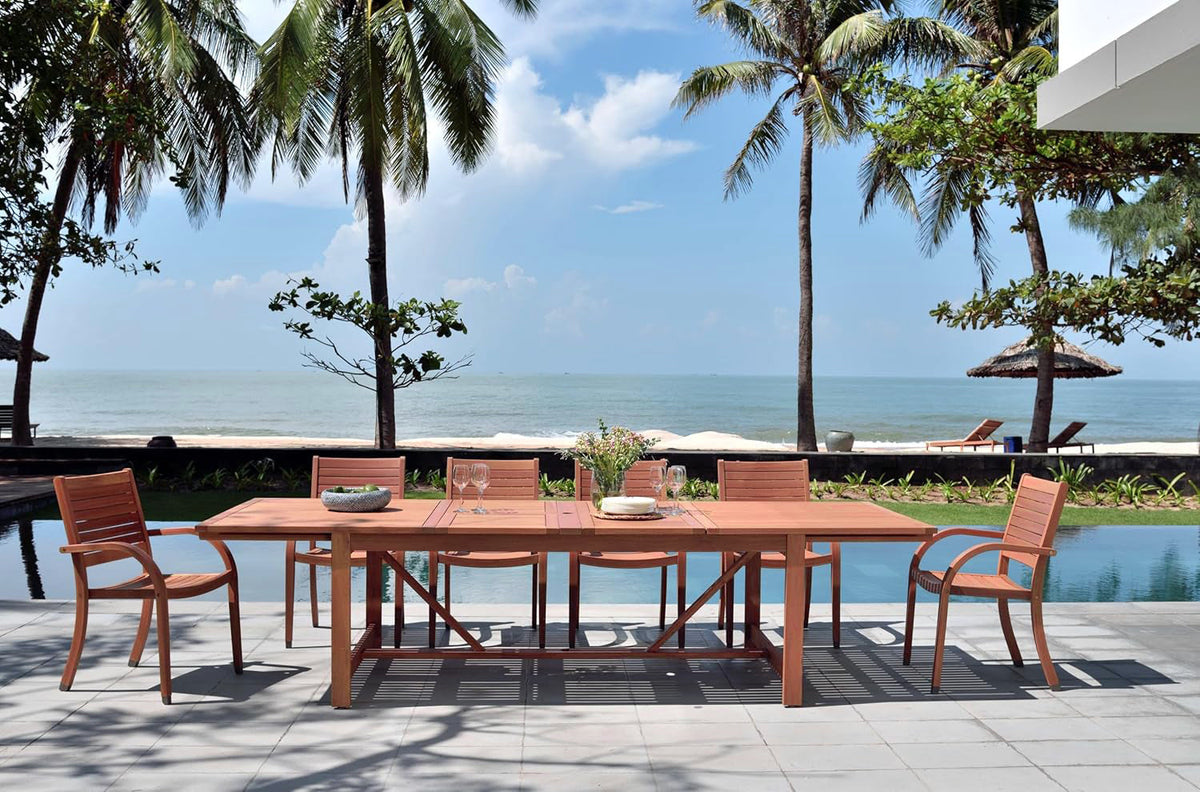 Catalina 4-piece stacking wood armchairs outdoor dining set around a long wood table on Tampa Home & Garden Store