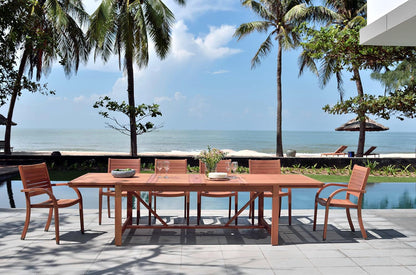 Catalina 4-piece stacking wood armchairs outdoor dining set around a long wood table on Tampa Home & Garden Store