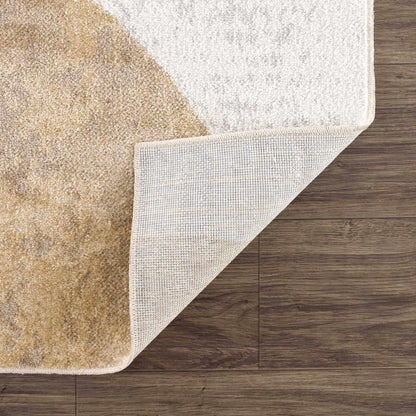 Giza Washable Area Rug two-tone tan and ivory with fringe trim on wood floor on Tampa Home & Garden Store