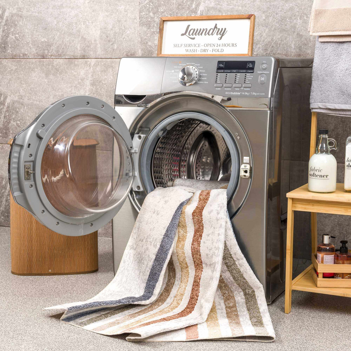 Giza washable area rug by Boutique Rugs in beige with gray stripes, beside a laundry washer on Tampa Home & Garden Store