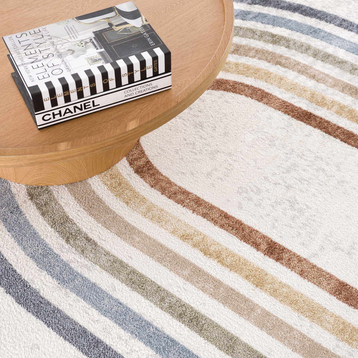 Giza Washable Area Rug, plush striped rug in blue, tan, brown cream on light floor on Tampa Home & Garden Store