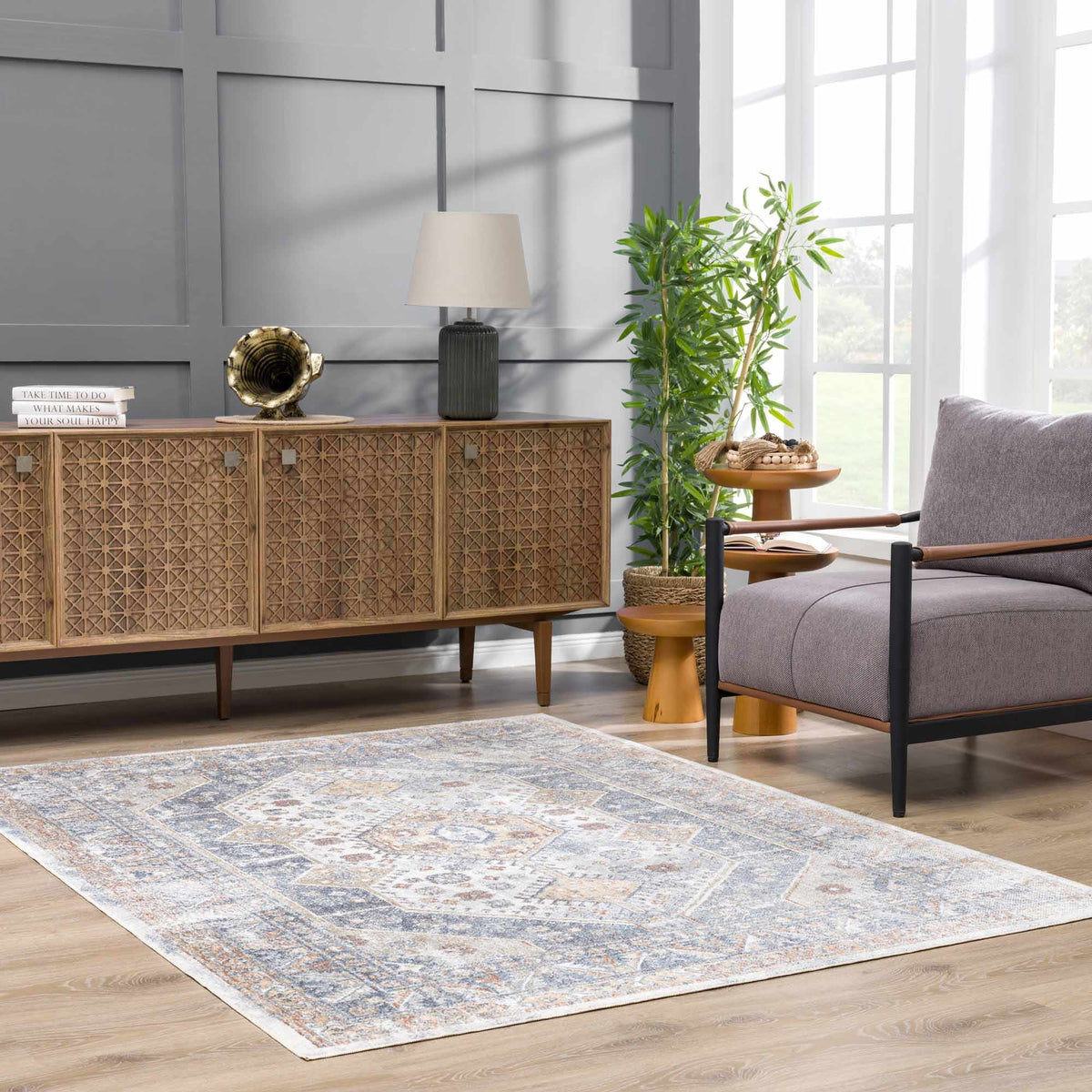 Afya Boutique Washable Rug blue gray intricate area rug in living room setup on Tampa Home & Garden Store