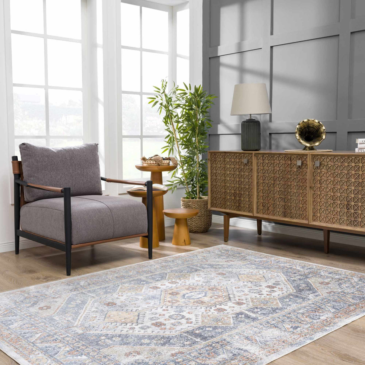 Afya Boutique Washable Rug by Boutique Rugs blue-gray geometric rug in a modern living room on Tampa Home & Garden Store