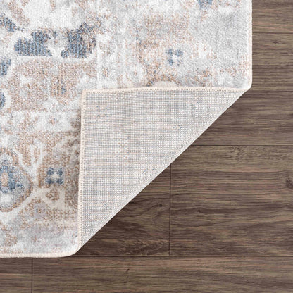 Dobry Boutique Washable Rug cream beige with blue accents; Boutique Rugs brand rug on wood floor on Tampa Home & Garden Store