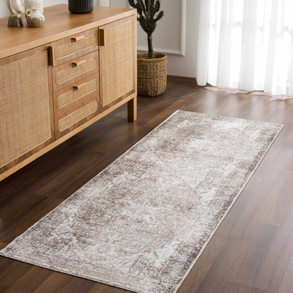 Hera Flat Pile Washable Rug by Boutique Rugs in beige with textured weave in a living room on Tampa Home & Garden Store