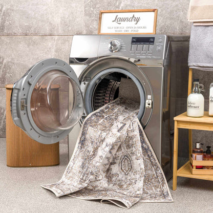 Hera flat-pile washable rug by Boutique Rugs in gray marble pattern with laundry backdrop on Tampa Home & Garden Store