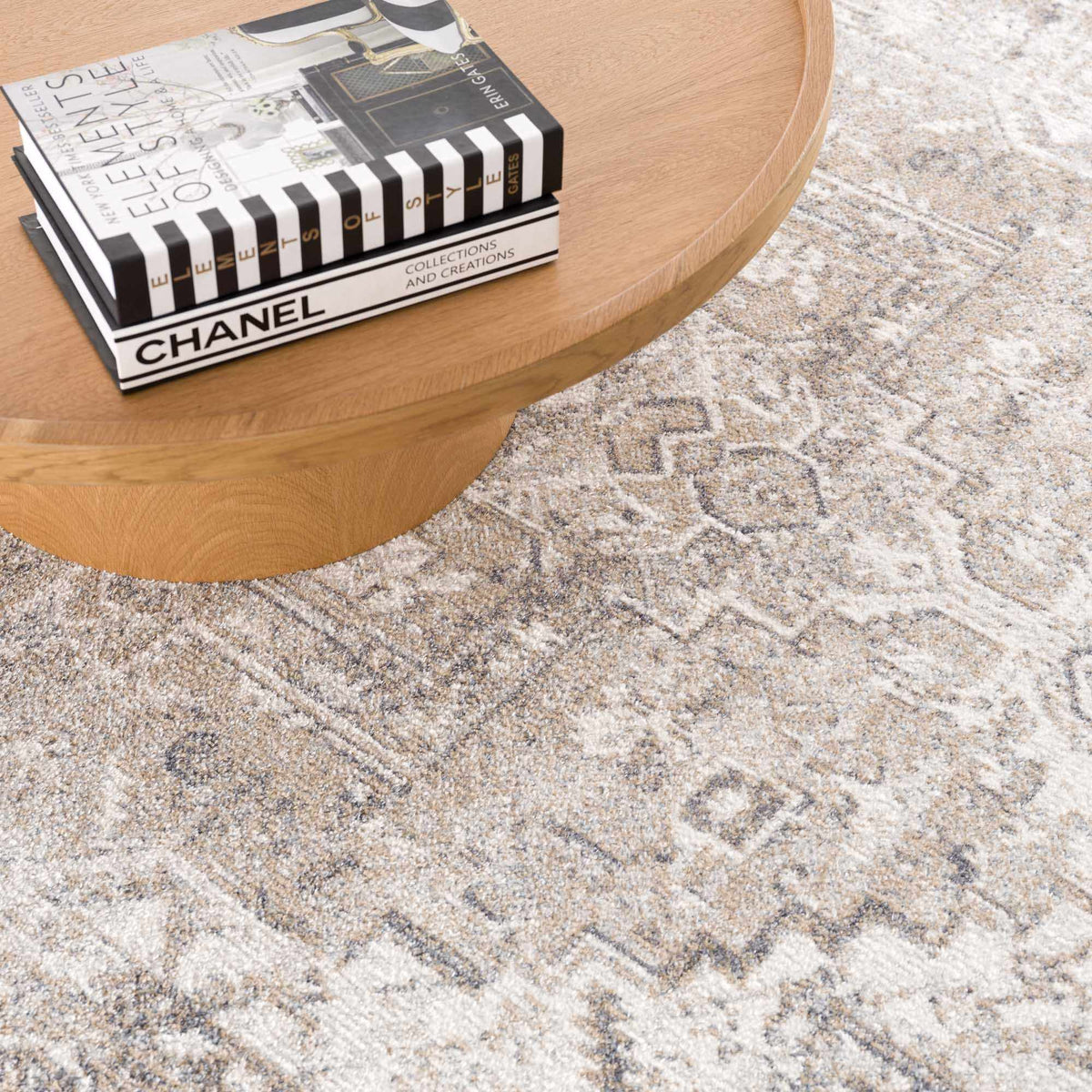 Hera Flat Pile Washable Rug beige gray pattern by Boutique Rugs on table Chanel magazines on Tampa Home & Garden Store