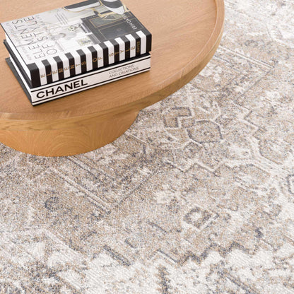 Hera Flat Pile Washable Rug beige gray pattern by Boutique Rugs on table Chanel magazines on Tampa Home & Garden Store