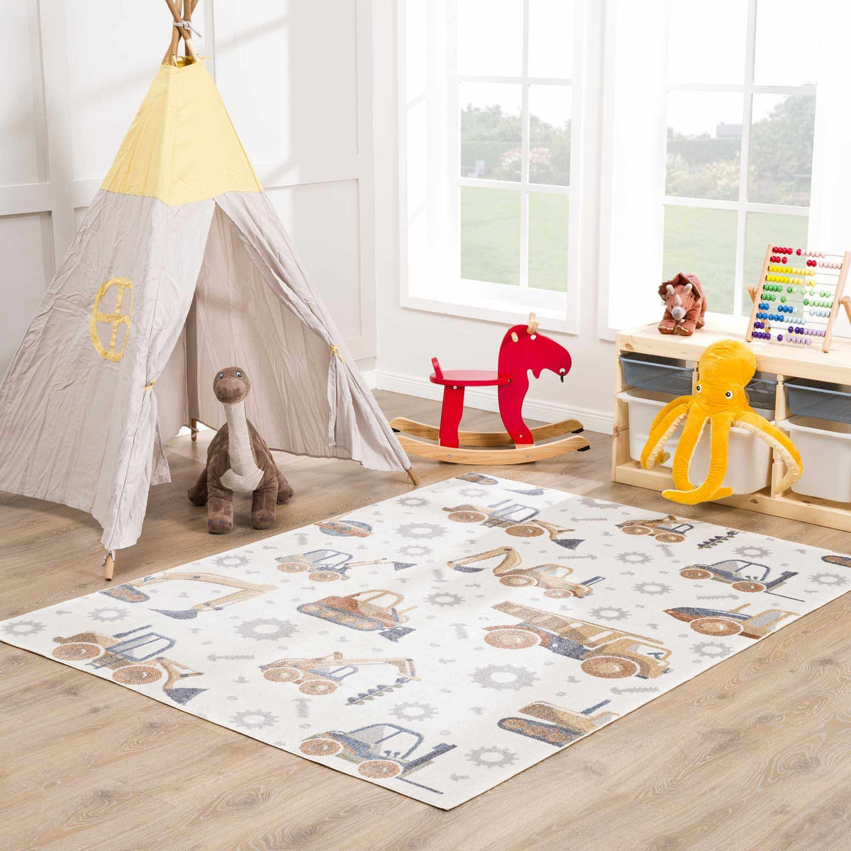 Construction Washable Kids Area Rug by Boutique Rugs with vehicle motifs on ivory background on Tampa Home & Garden Store