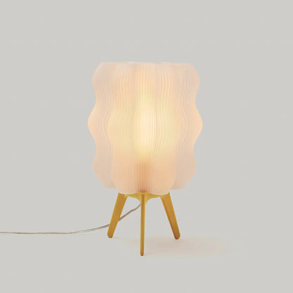 Eco friendly wavy jellyfish desk light by Wooj Design with beige ribbed shade on a yellow tripod on Tampa Home & Garden Store