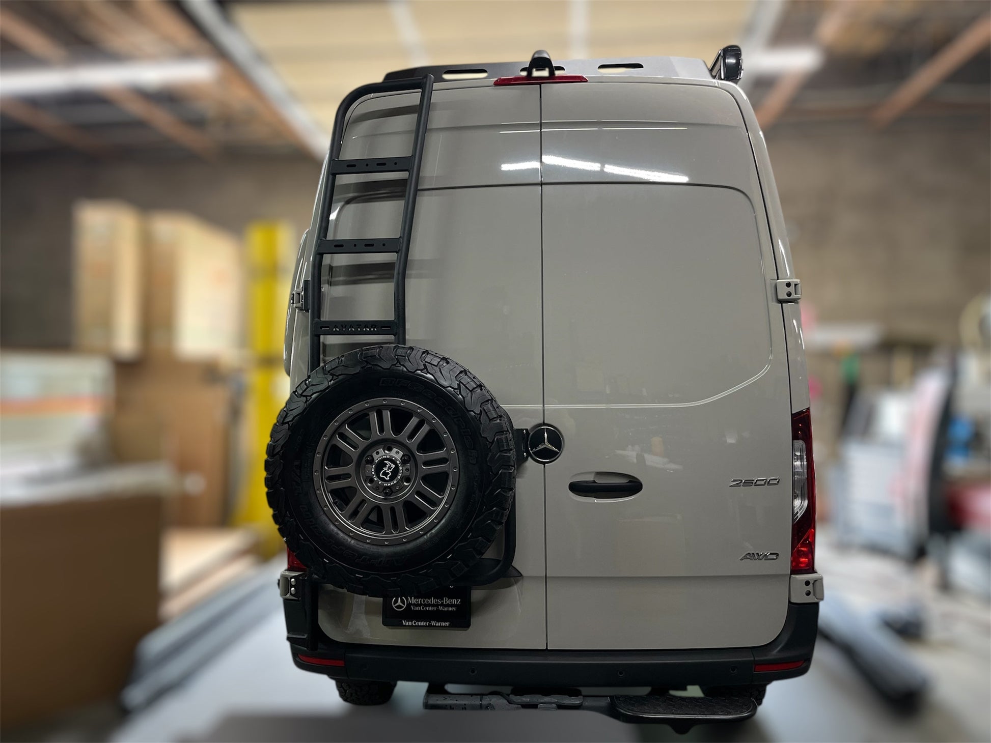 Avatar Van Rear Ladder Tire Carrier rear-mounted ladder with spare tire on back of van avatar on Tampa Home & Garden Store