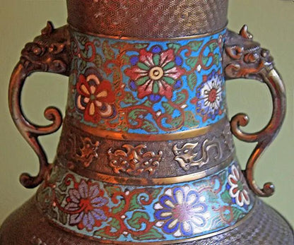 Decorative metal vase with multicolor enamel floral pattern and ornate dragon-handled sides on Tampa Home & Garden Store