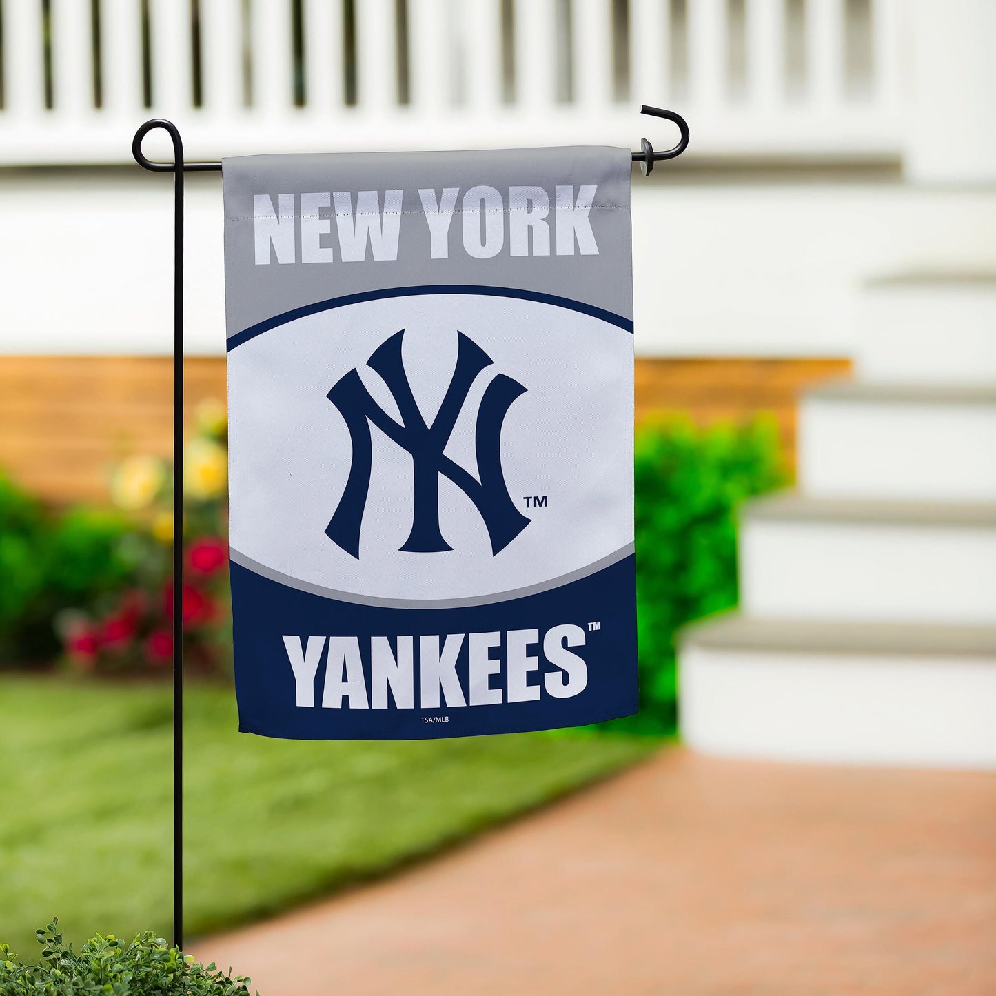 New York Yankees suede flag banner in gray fabric with navy logo on a metal garden stand on Tampa Home & Garden Store