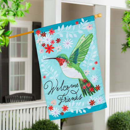 Hummingbird Welcome Applique House Flag turquoise background with flowers and bird on porch on Tampa Home & Garden Store