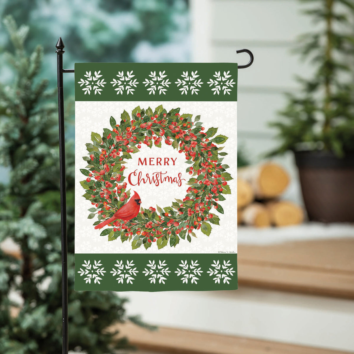 Moire Garden Flag: Christmas cardinal wreath with red berries on green border and snowflakes on Tampa Home & Garden Store