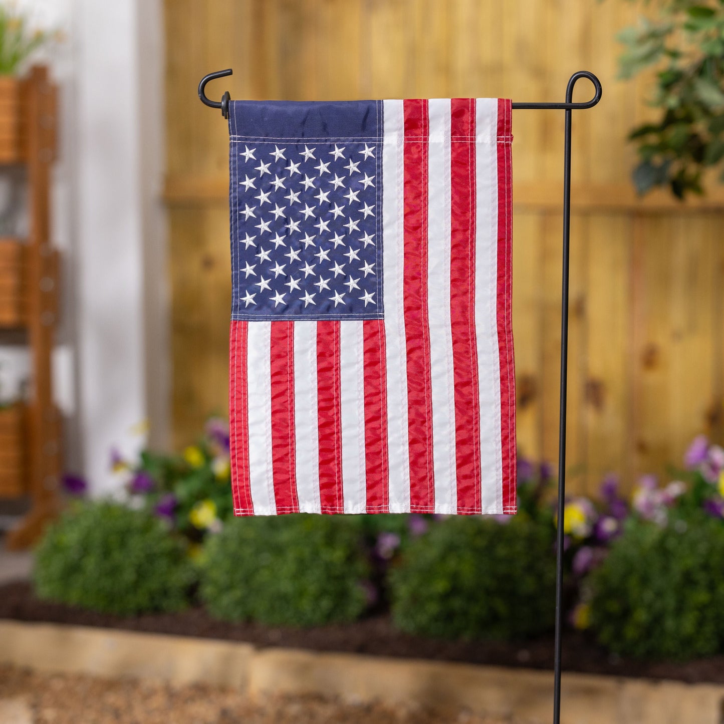 American Flag Garden Flag with blue canton and stars, red and white stripes on a stand on Tampa Home & Garden Store
