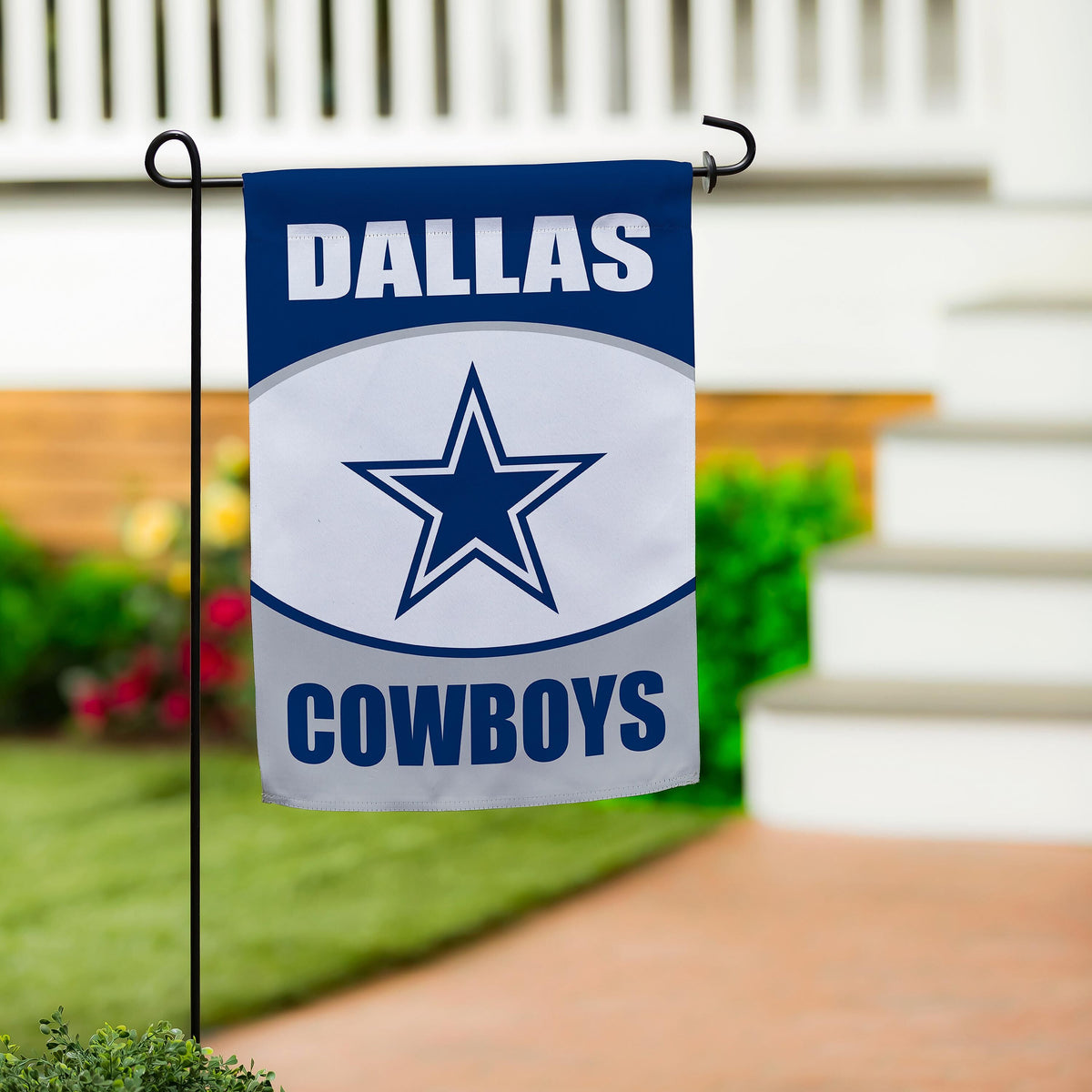 Dallas Cowboys suede flag blue with white DALLAS letters and star on a black metal stand on Tampa Home & Garden Store