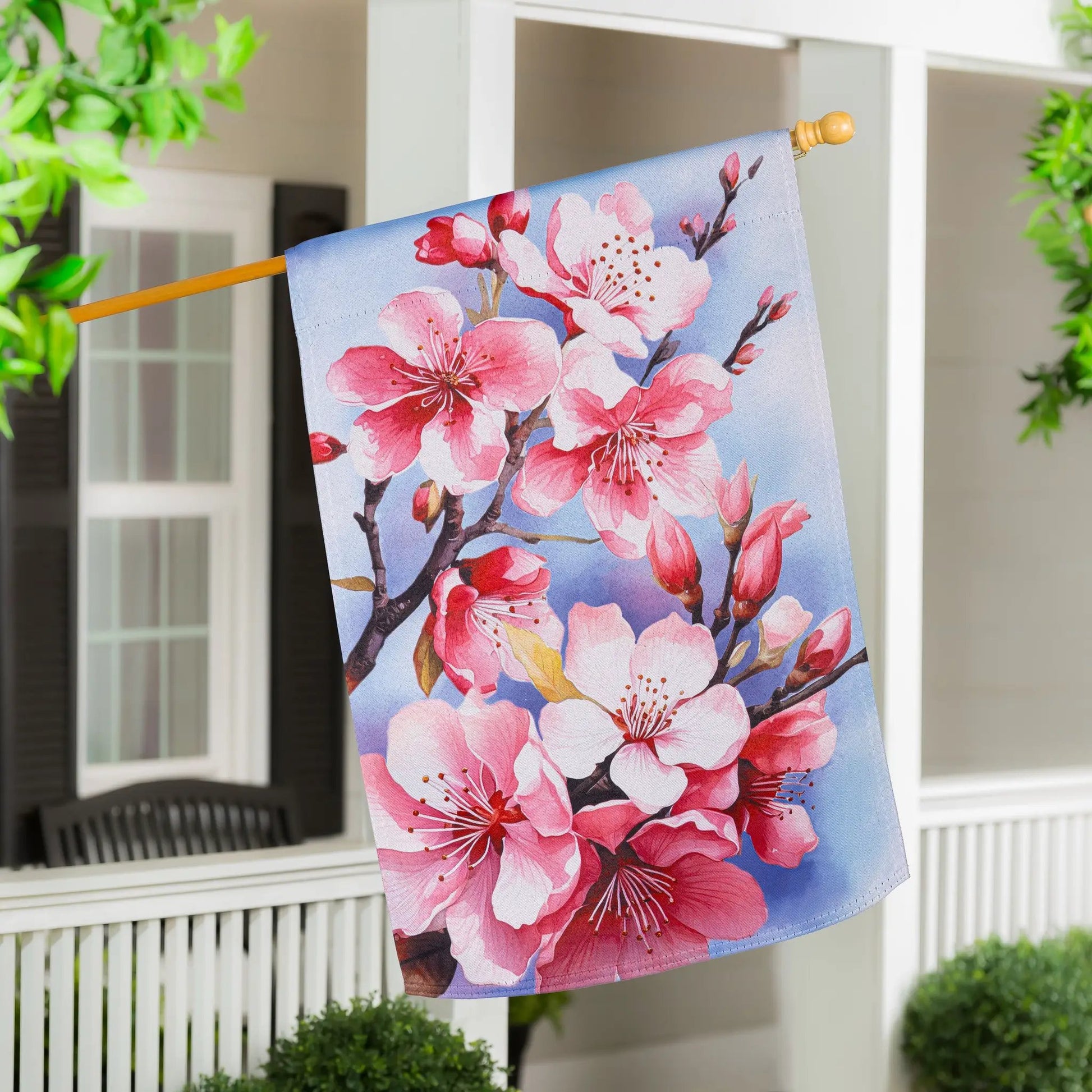 Cherry Blossom Suede Garden Flag on light blue background with pink flowers and wooden pole on Tampa Home & Garden Store