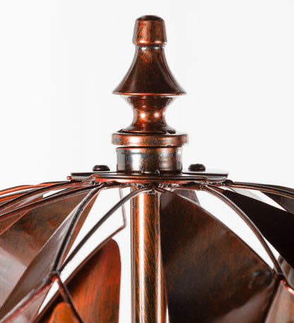 Harlequin Ball Wind Spinner top finial in copper patina with flared collar and radiating blades on Tampa Home & Garden Store