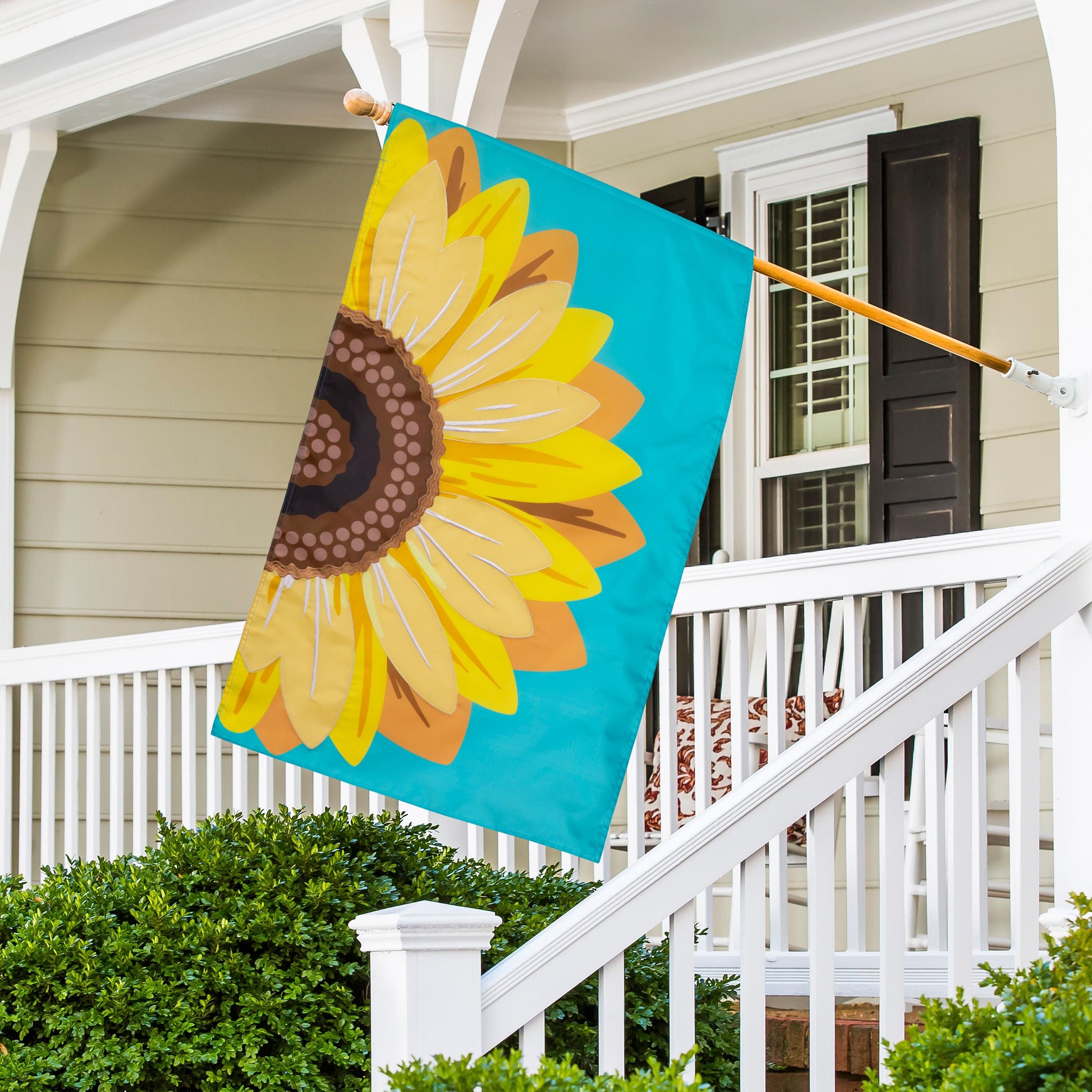 Sunflower Basic Applique House Flag turquoise flag with yellow petals brown center on porch on Tampa Home & Garden Store