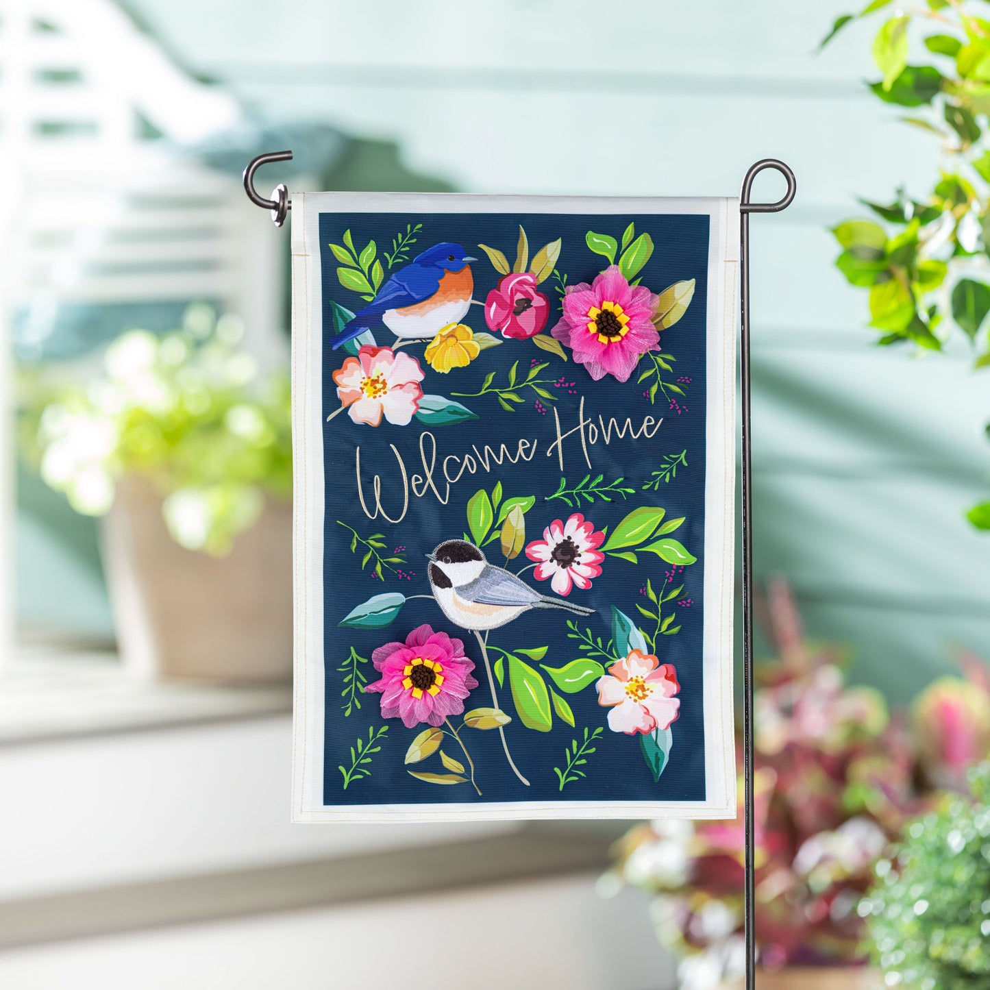 Welcome Home Songbirds Applique Garden Flag navy background with vibrant flowers and birds on Tampa Home & Garden Store