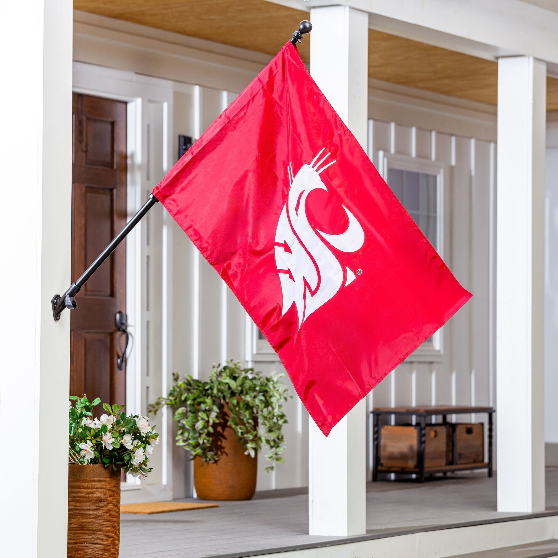 Applique flag red with Washington State University emblem on porch display on Tampa Home & Garden Store