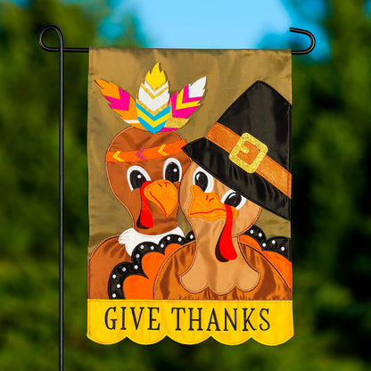 Pilgrim Couple applique garden flag with brown turkey and colorful feathers, GIVE THANKS banner on Tampa Home & Garden Store