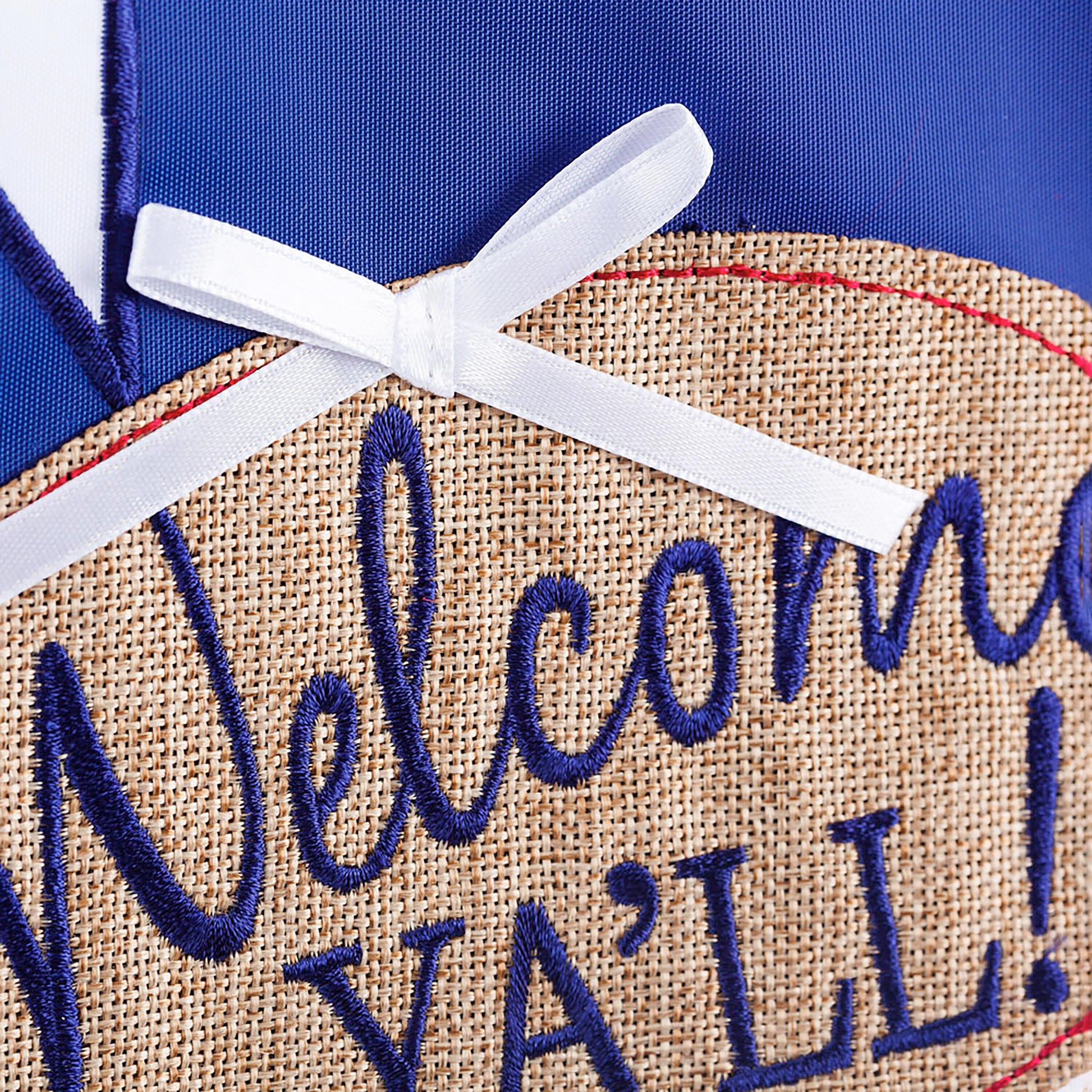 Texas Blue Bonnets Garden Applique Flag close-up, blue fabric with white bow and burlap base on Tampa Home & Garden Store