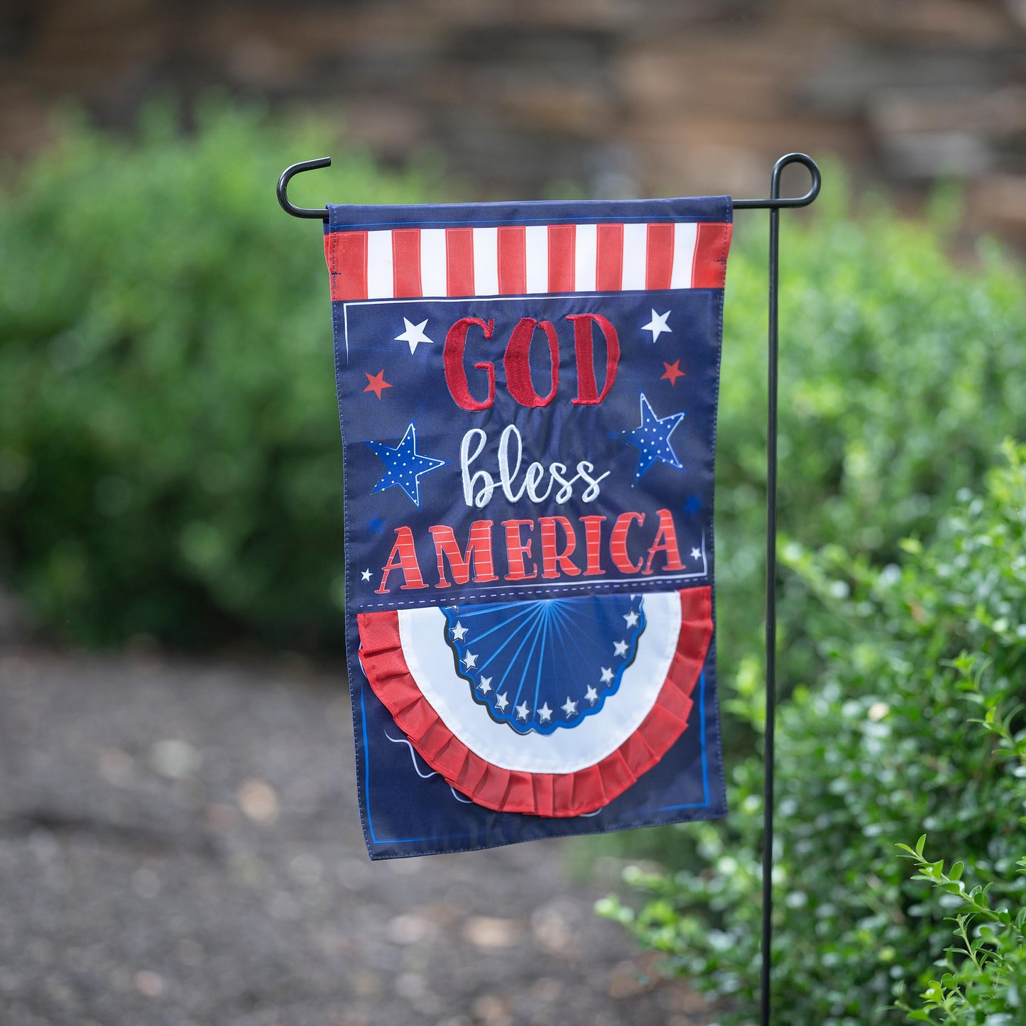 Patriotic applique garden flag with red stripes and blue field with stars reading God Bless America on Tampa Home & Garden Store
