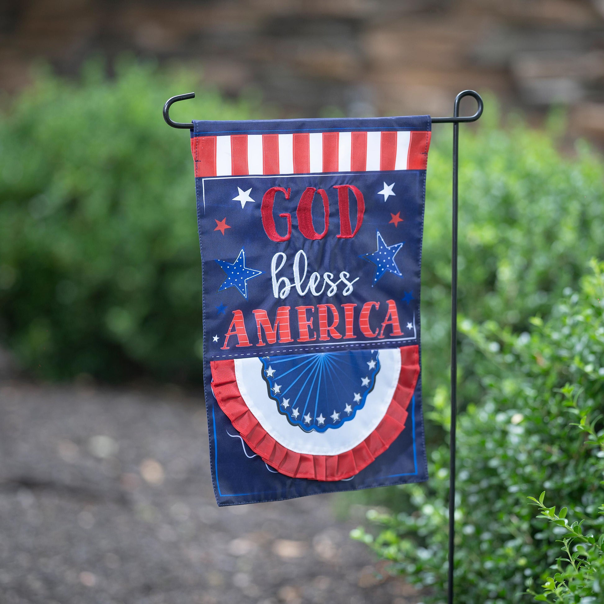 Patriotic applique garden flag with red stripes and blue field with stars reading God Bless America on Tampa Home & Garden Store