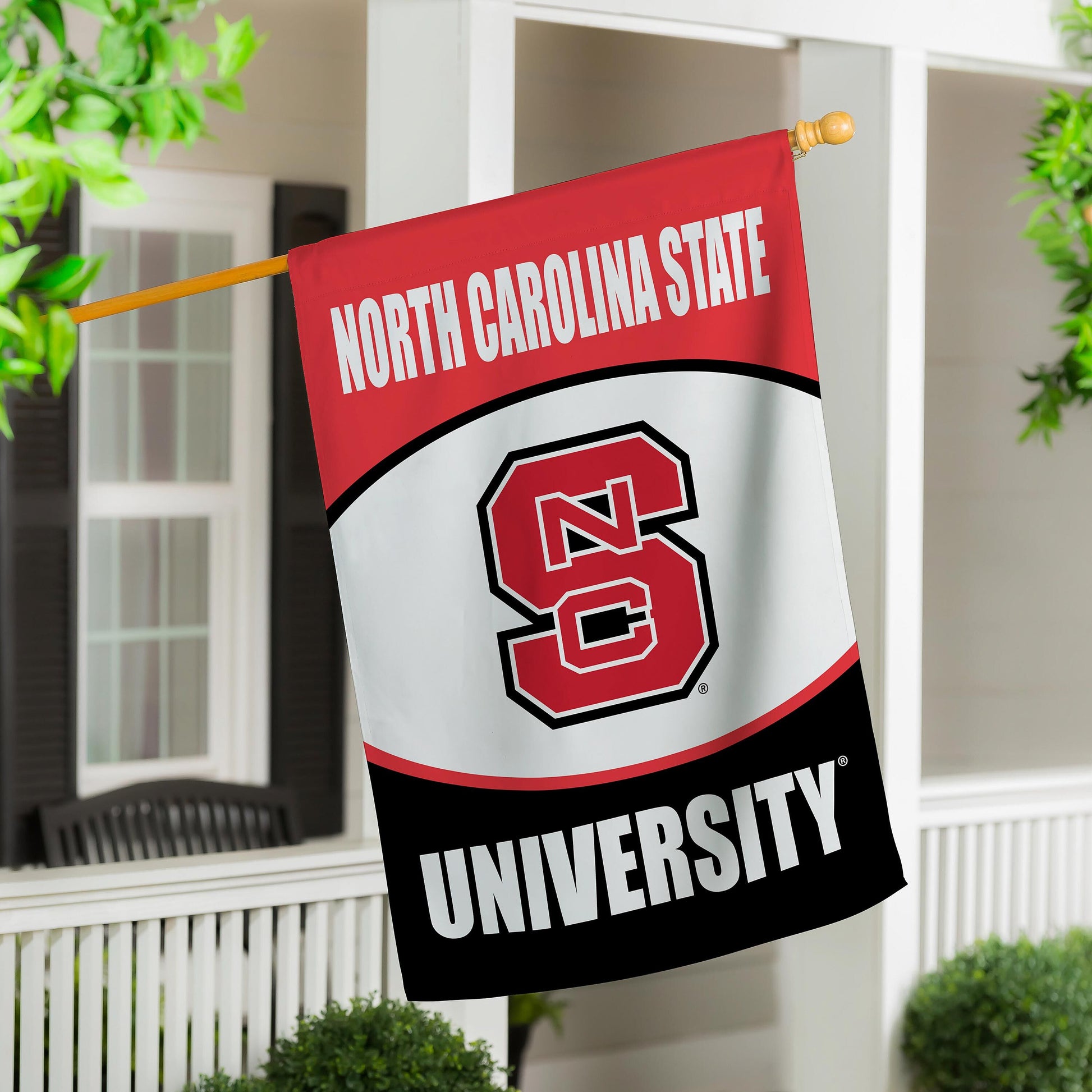 North Carolina State University suede flag on wooden pole with red banner and NC logo on Tampa Home & Garden Store