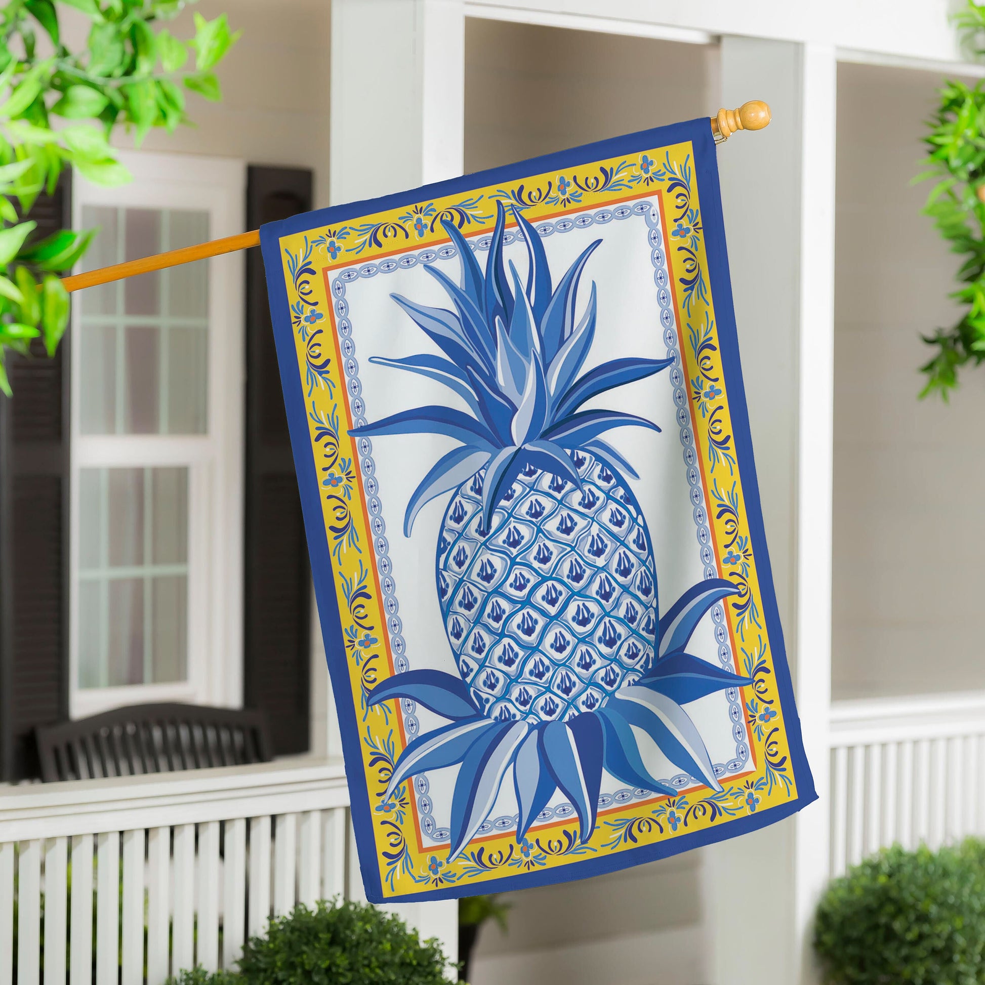 Blue & White Pineapple Applique House Flag on a wooden pole on Tampa Home & Garden Store