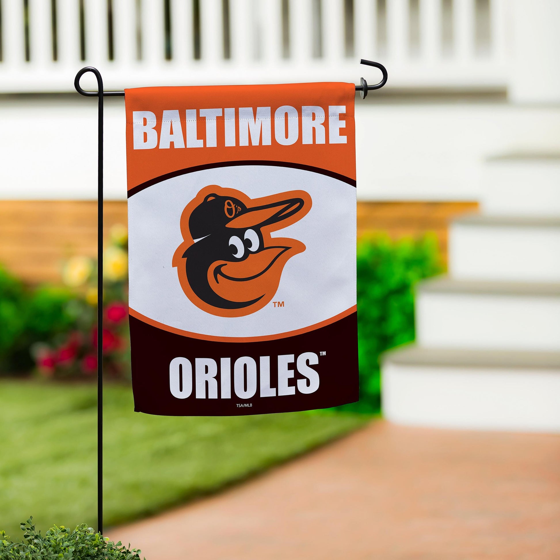 Baltimore Orioles suede flag on black stake with orange header and logo on Tampa Home & Garden Store