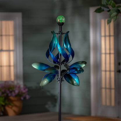 Seaside Retreat Wind Spinner solar blue teal gradient with glowing green LED globe at top on Tampa Home & Garden Store