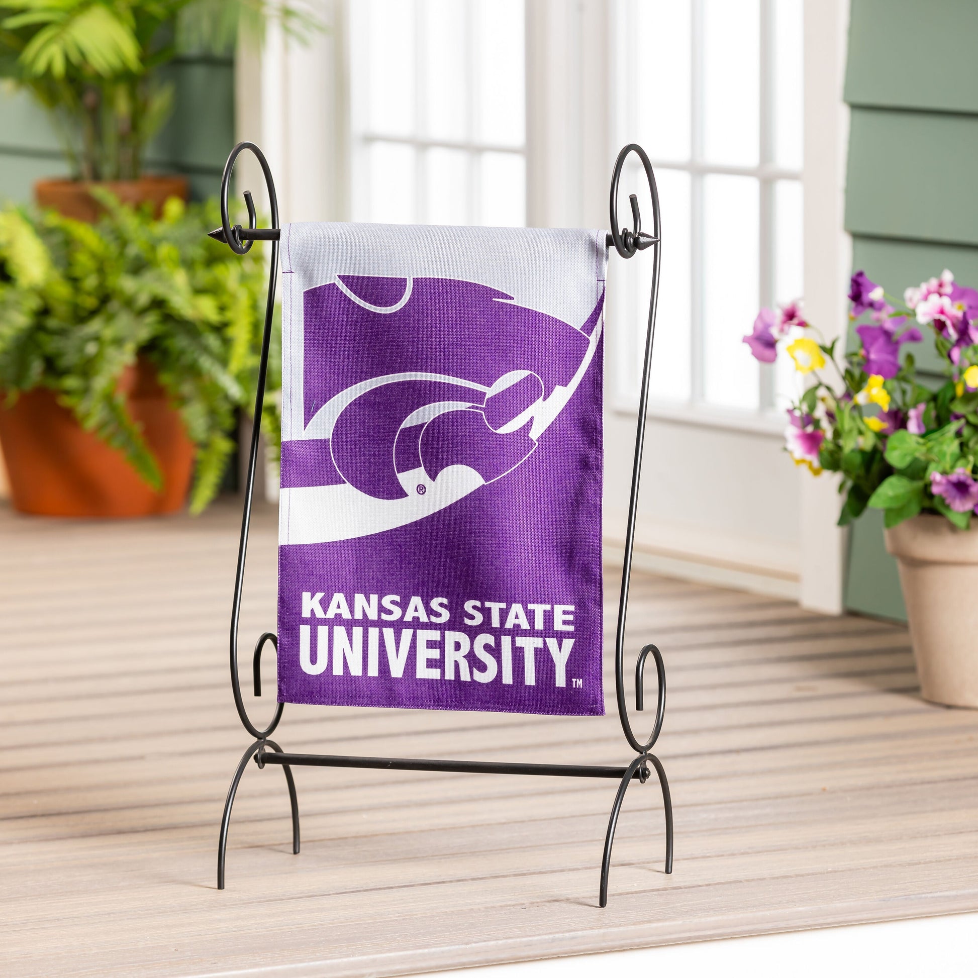 Kansas State University burlap garden flag in purple and white on metal stand on Tampa Home & Garden Store