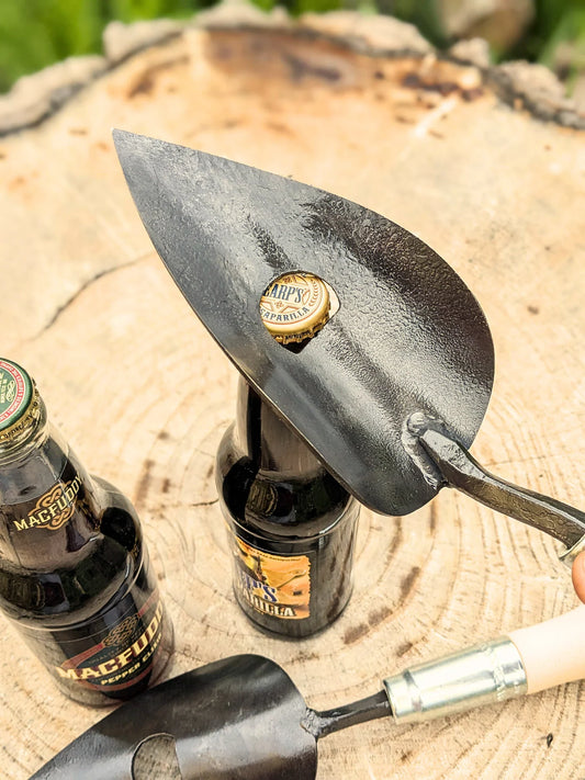 Large black trowel with built-in bottle opener and hammered blade by Homestead Iron, LLC on Tampa Home & Garden Store