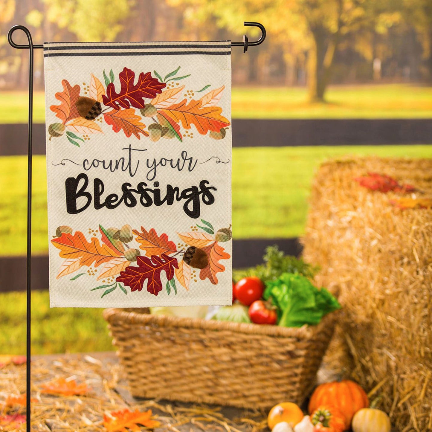 Count Your Blessings garden burlap flag with autumn leaves design on a metal garden stand on Tampa Home & Garden Store