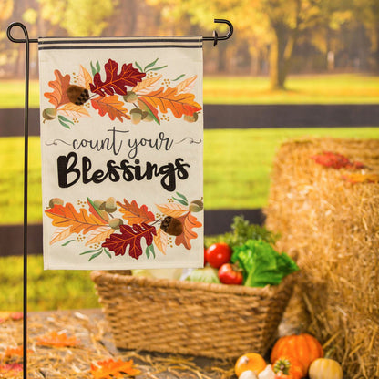 Count Your Blessings garden burlap flag with autumn leaves design on a metal garden stand on Tampa Home & Garden Store