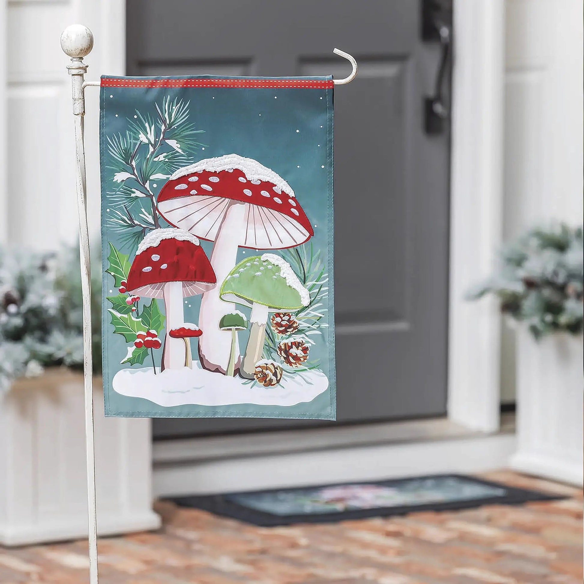 Woodland Winter Mushroom Applique Garden Flag featuring teal background with red mushrooms and pine, Evergreen Enterprises on Tampa Home & Garden Store
