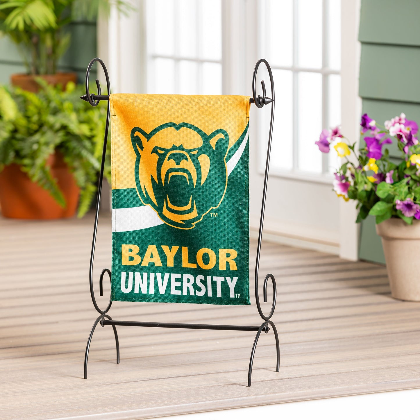 Burlap Baylor University flag garden size with bear on yellow background on black stand on Tampa Home & Garden Store