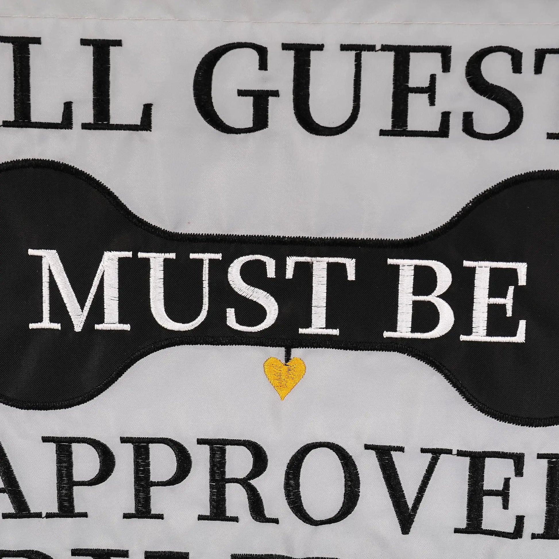 Approved by the Dog applique flag with black lettering on white fabric and a yellow heart on Tampa Home & Garden Store