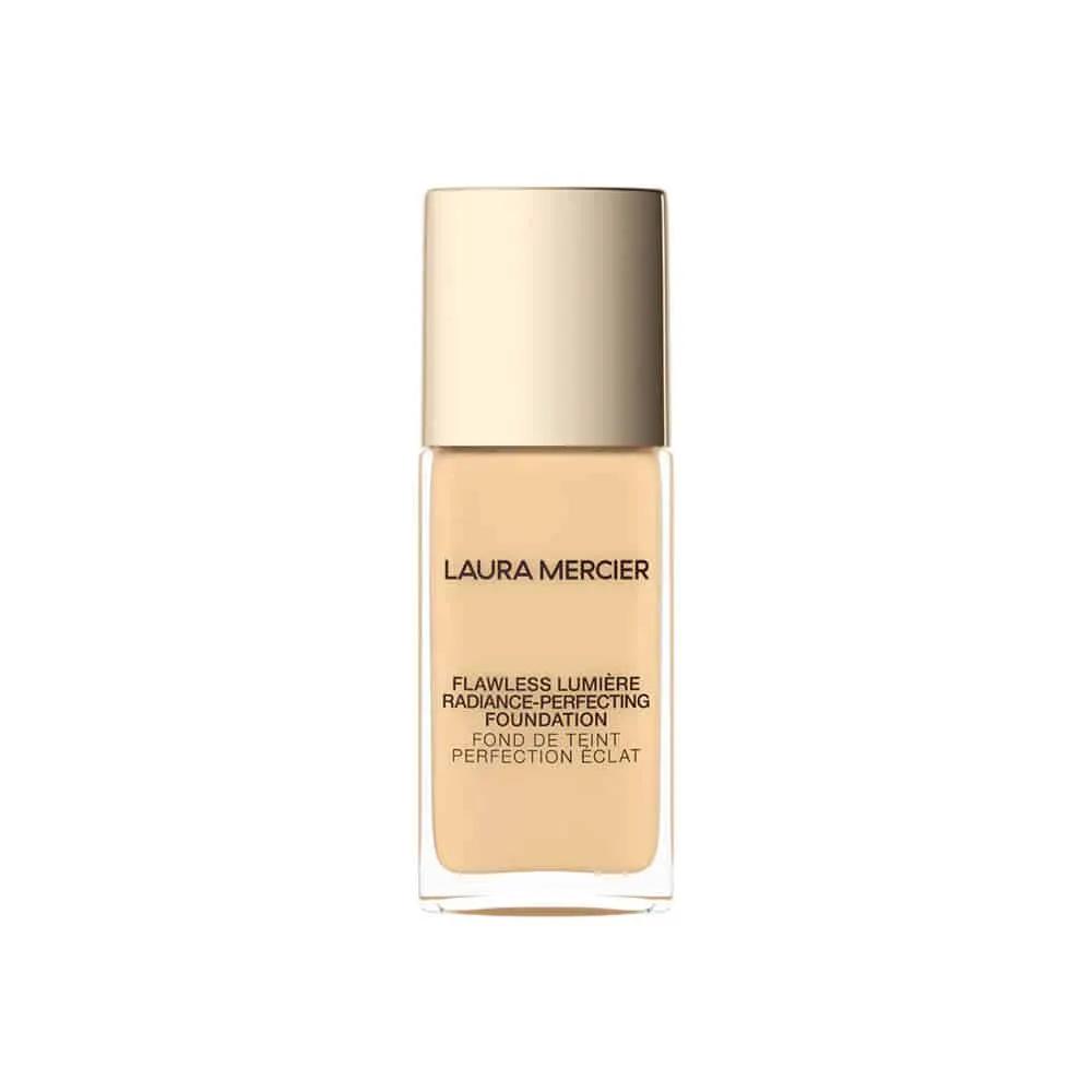 Laura Mercier Flawless Lumiere Foundation bottle in beige with a gold cap. on Tampa Home & Garden Store