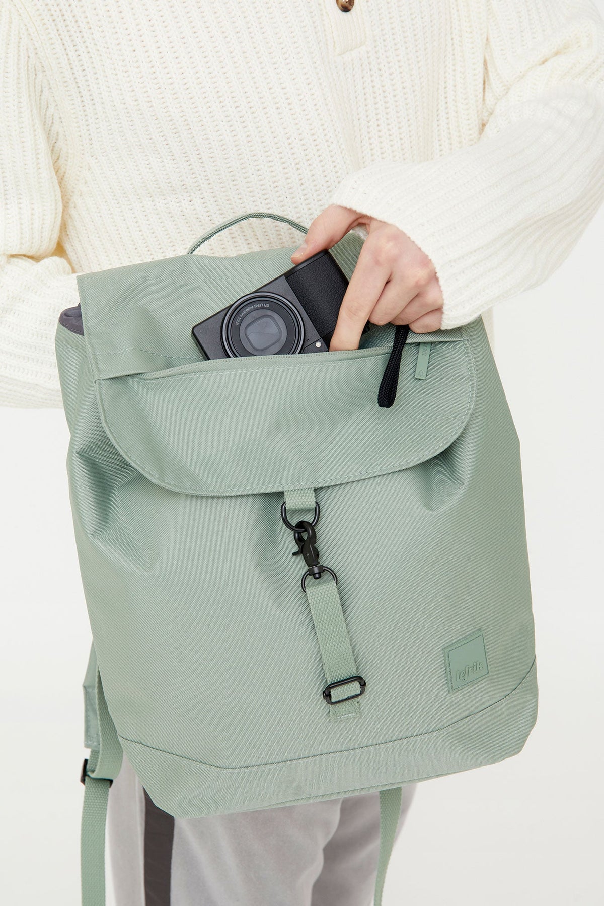 Kaut Backpack Sage 19L by Lefrik USA; sage green backpack with front pocket and camera on Tampa Home & Garden Store