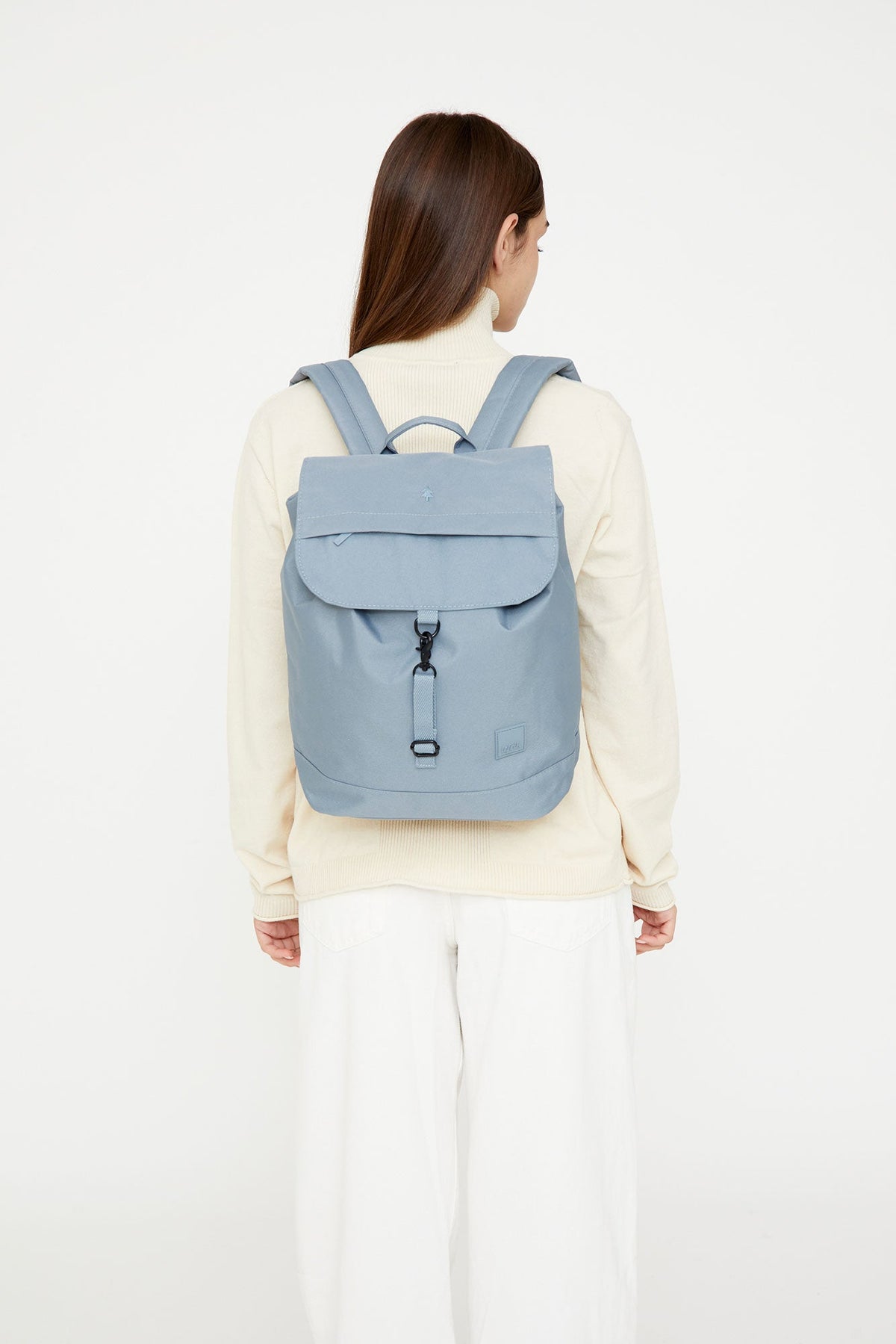 Lefrik Kaut backpack stone blue 19.2 L with 14in laptop sleeve worn on back on Tampa Home & Garden Store