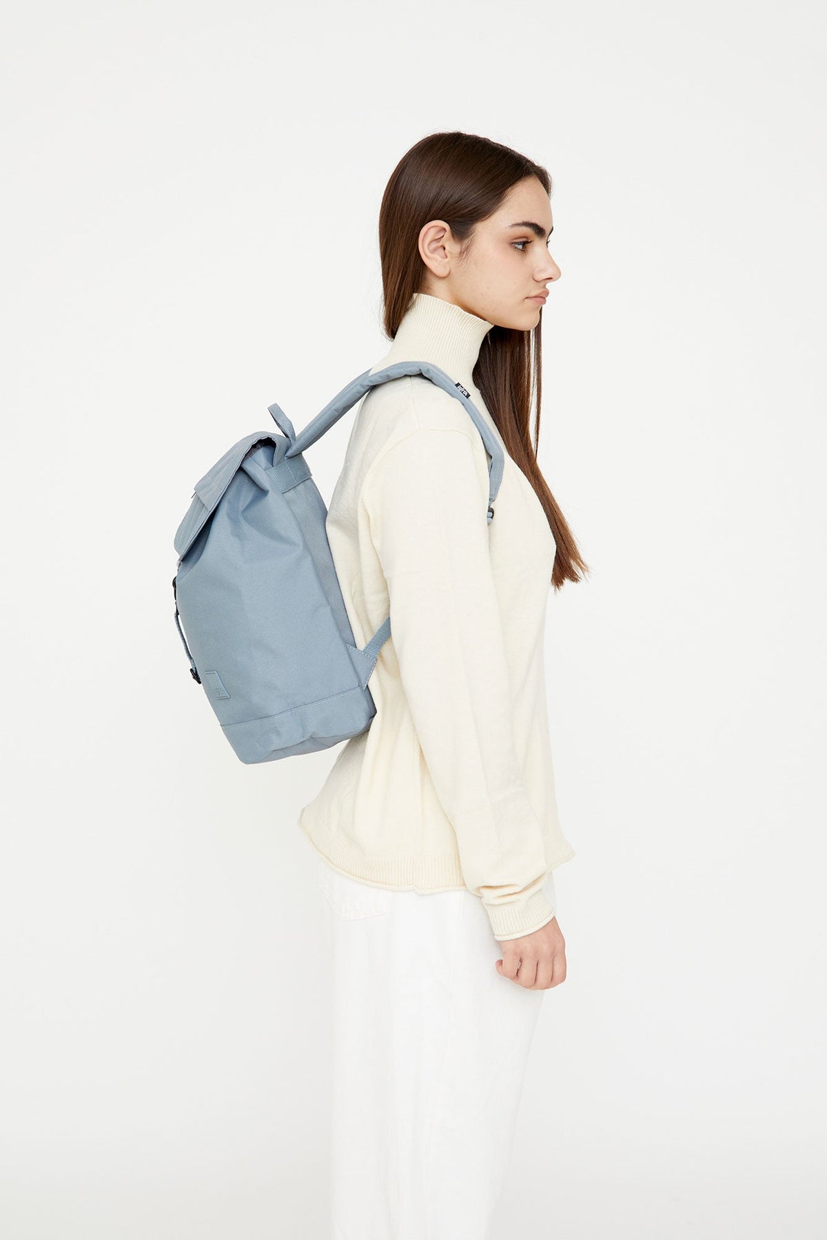 Kaut Backpack Stone Blue 19.2L Lefrik USA, 14 inch laptop compatible, worn by model on Tampa Home & Garden Store