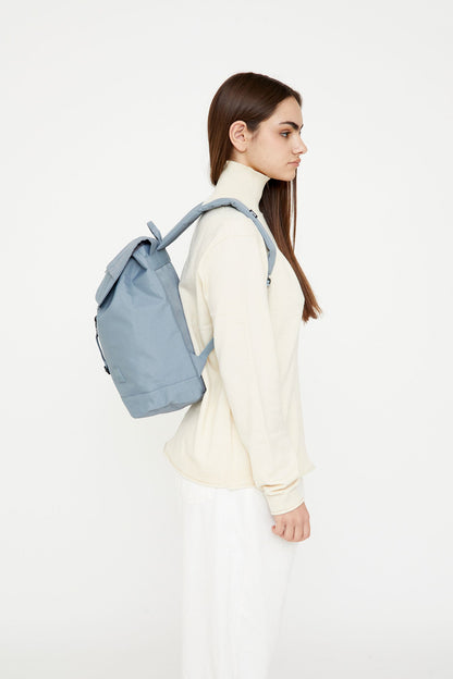 Kaut Backpack Stone Blue 19.2L Lefrik USA, 14 inch laptop compatible, worn by model on Tampa Home & Garden Store