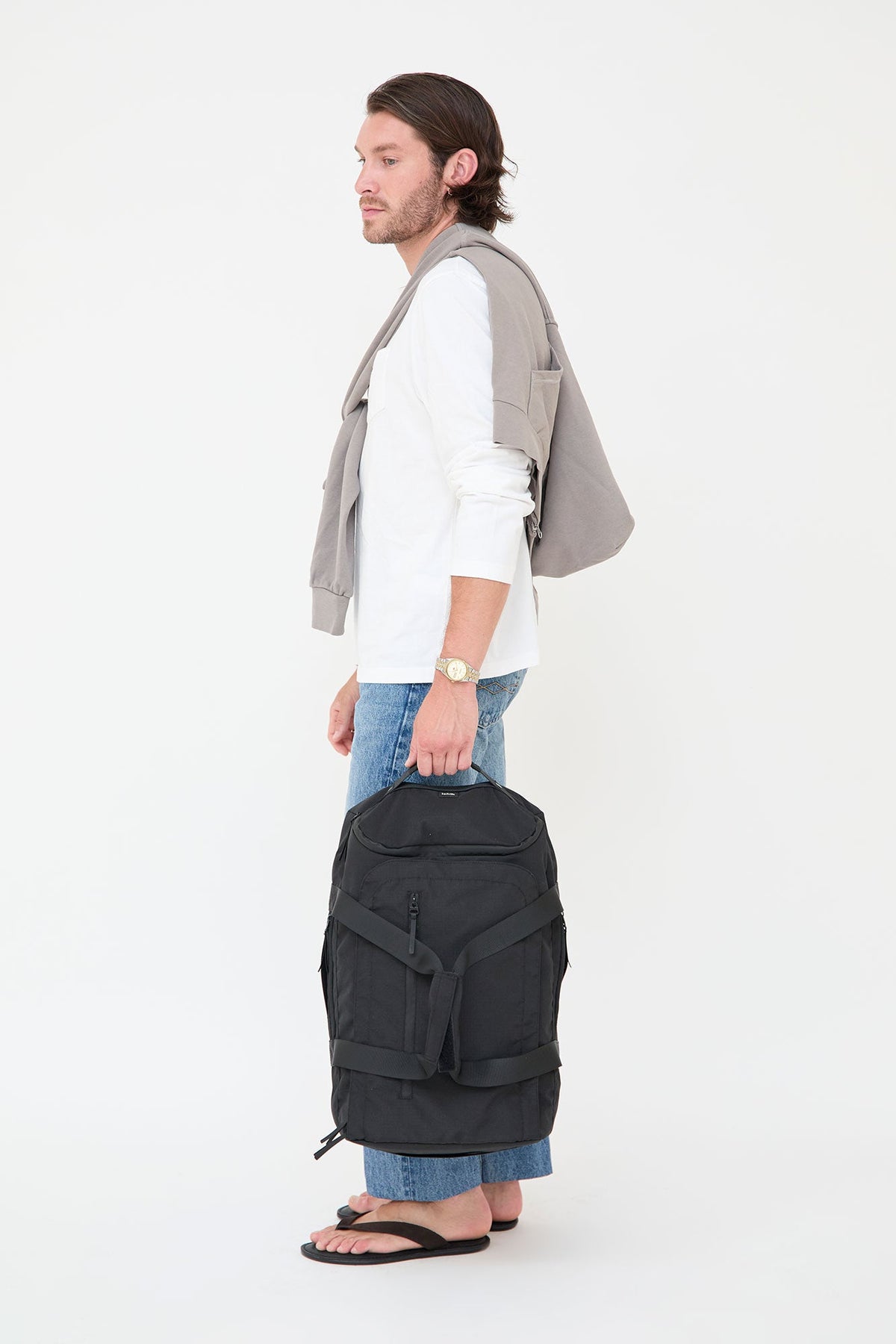 Wanderer 29L travel backpack Lefrik USA, black, shown on a male model with two bags on Tampa Home & Garden Store