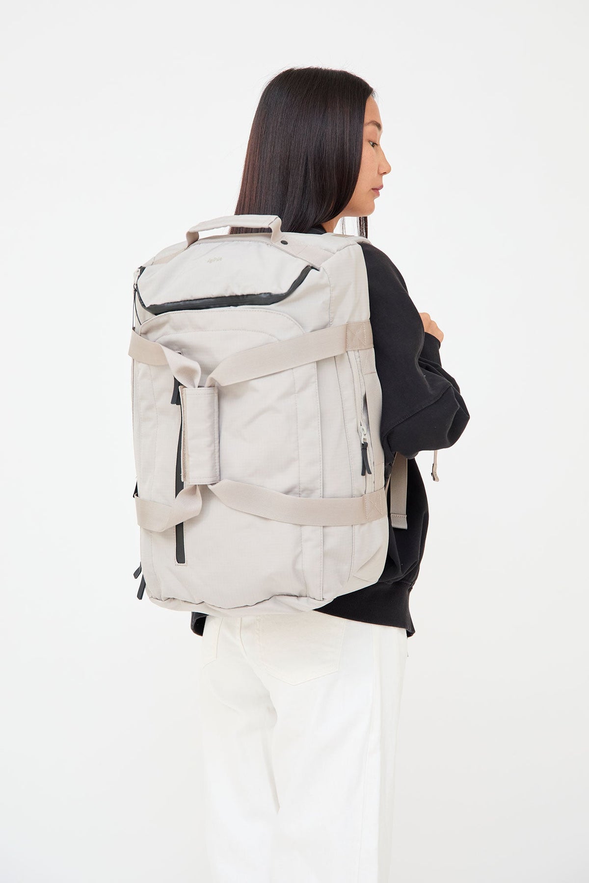 Wanderer backpack fossil travel laptop bag by Lefrik USA; light beige fabric with top handle, external zip pocket, and compression straps on Tampa Home & Garden Store