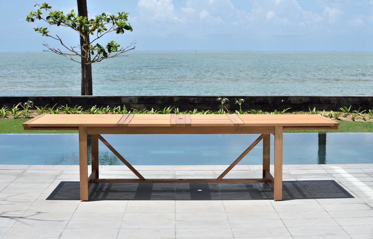 Leyland Table and 8 Chamonix Armchair Dining Set teak outdoor table on lakeside patio on Tampa Home & Garden Store