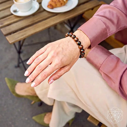 Bracelet The Self-Sabotage Breaker Mahogany Obsidian beaded on wrist with pink sleeve on Tampa Home & Garden Store